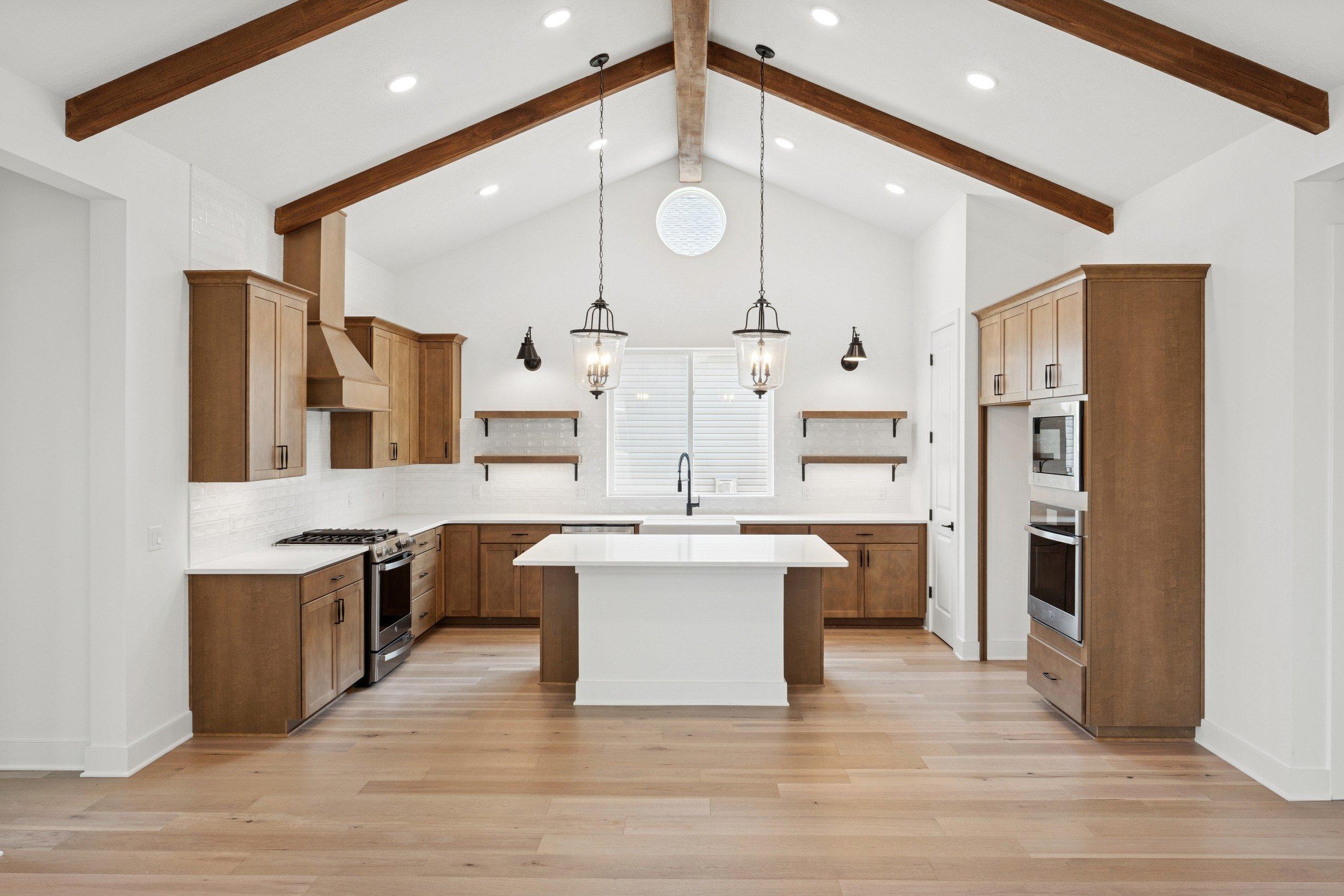 Kitchen with stained ceiling beams