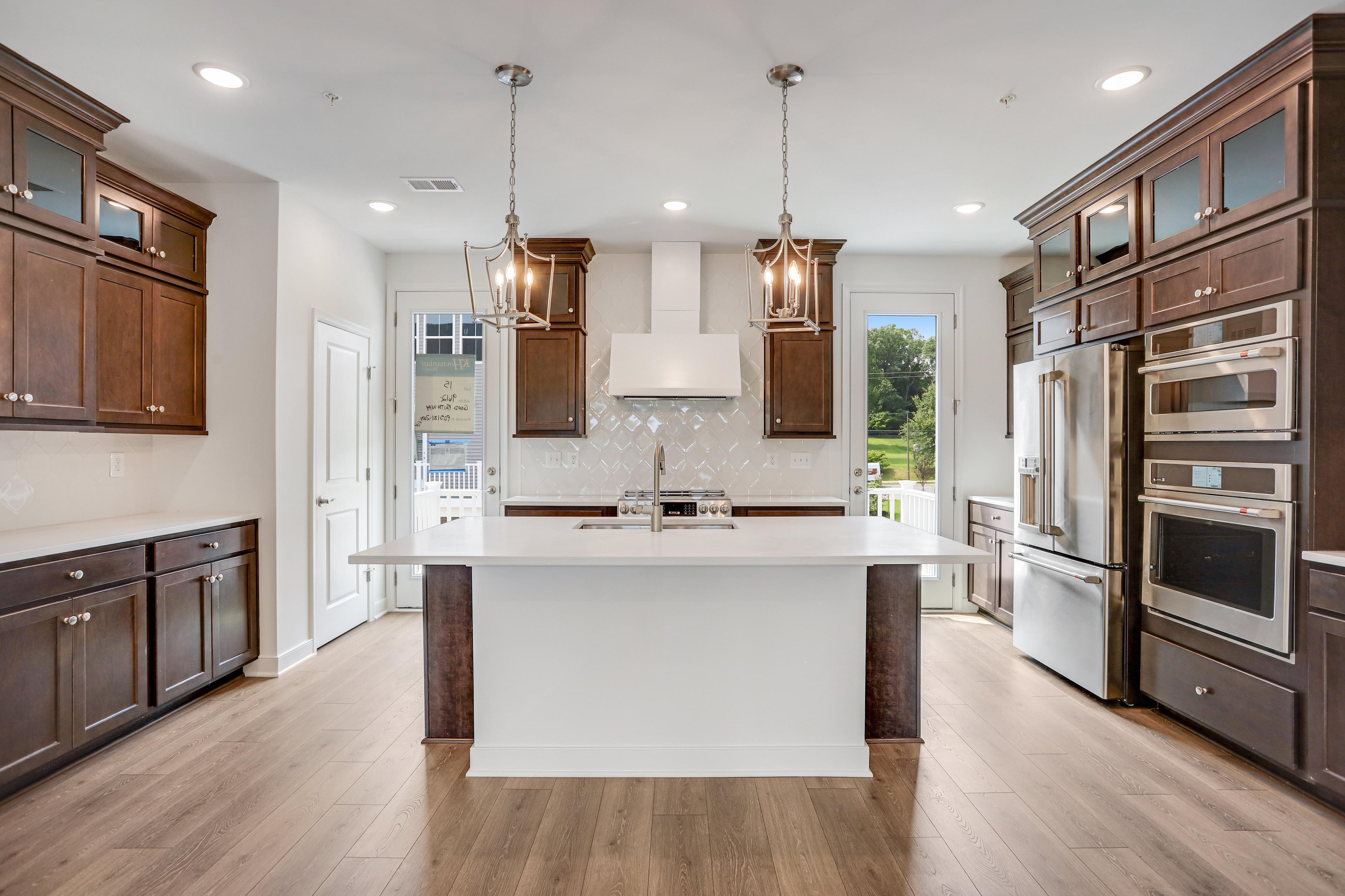 Kitchen with vast island & pendant lights